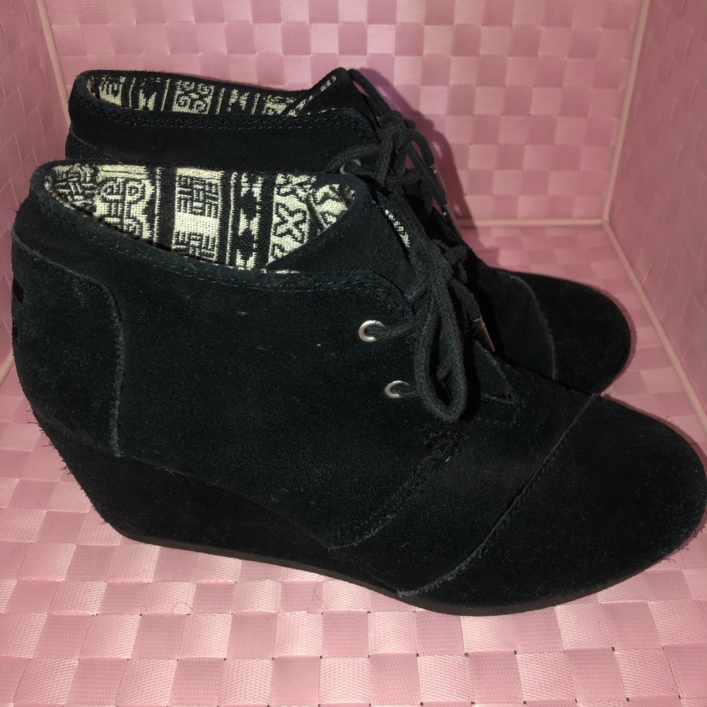 Tom’s black wedge bootie